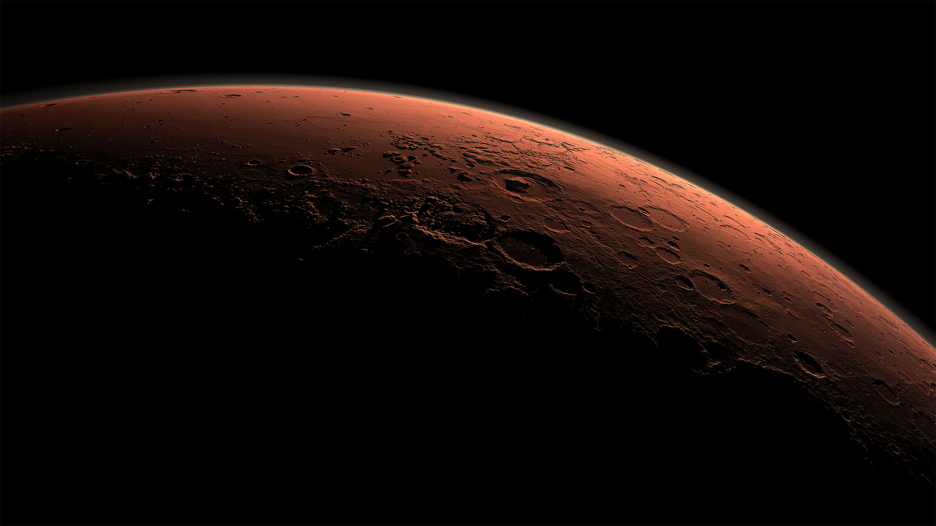 A planet’s illuminated horizon against space